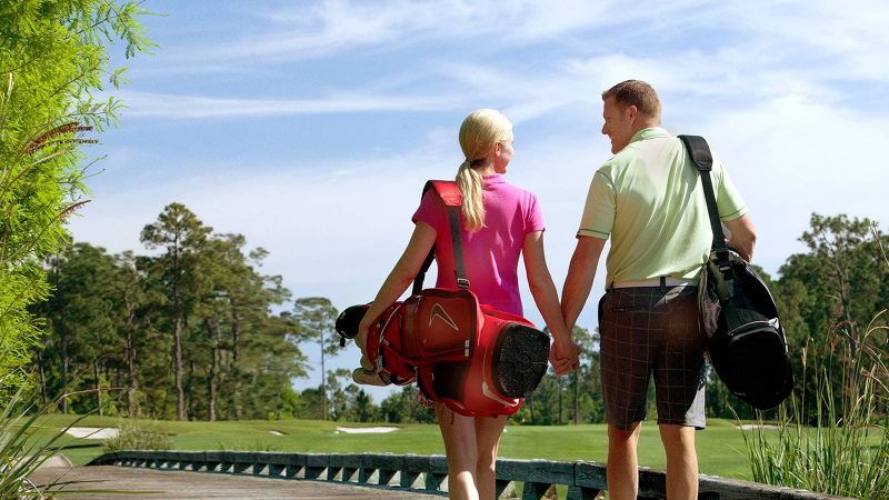 couple golfing